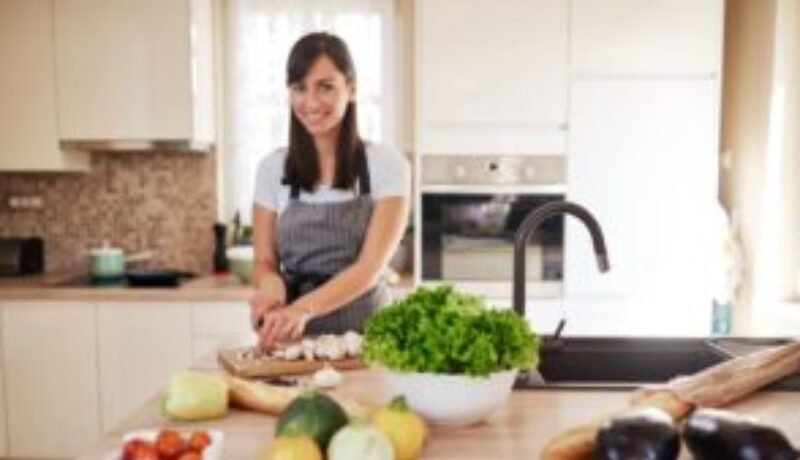 Advantages of early dinner. A woman preparing dinner.